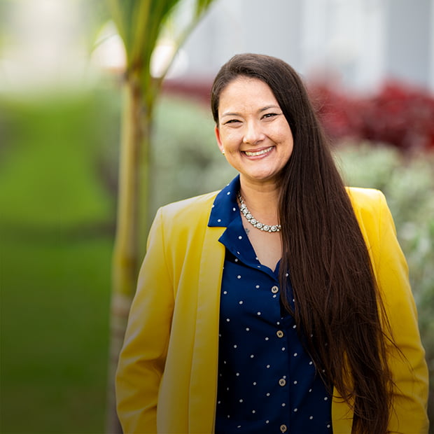 Ronda Passalacqua stands outside ythe First Watch corporate office in Florida