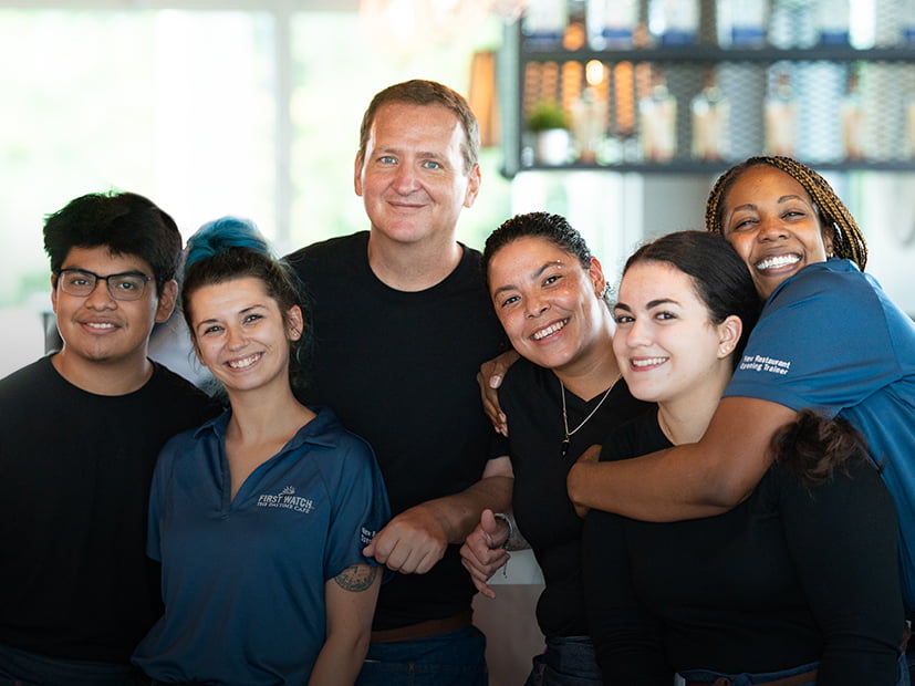 Group of employees laugh together