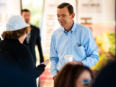 First Watch Co-Founder Ken Pendery greets guests at new restaurant opening